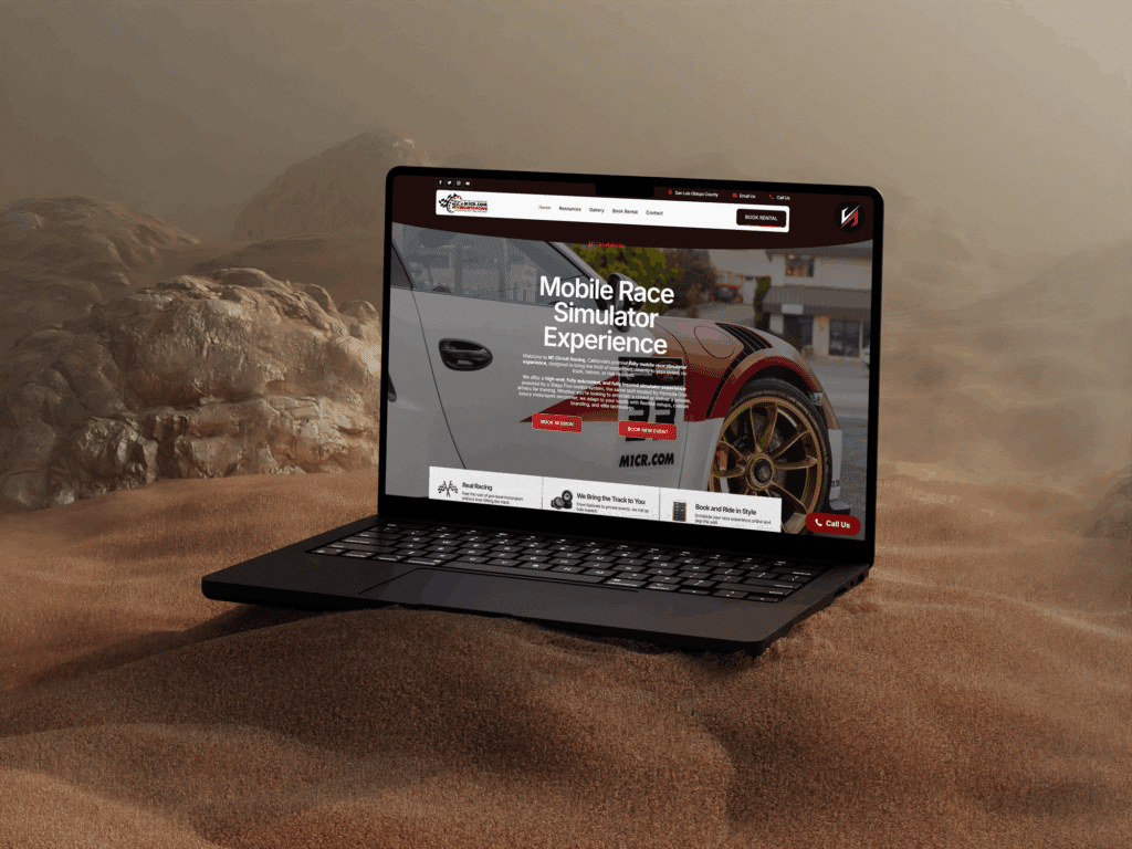 Laptop displaying M1 Circuit Racing website featuring mobile race simulator experience, set against a sandy background, emphasizing advanced technology and engaging user interface.