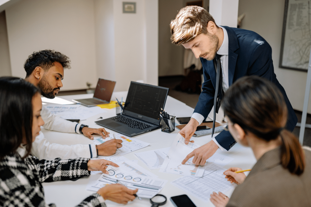digital marketing team reviewing notes