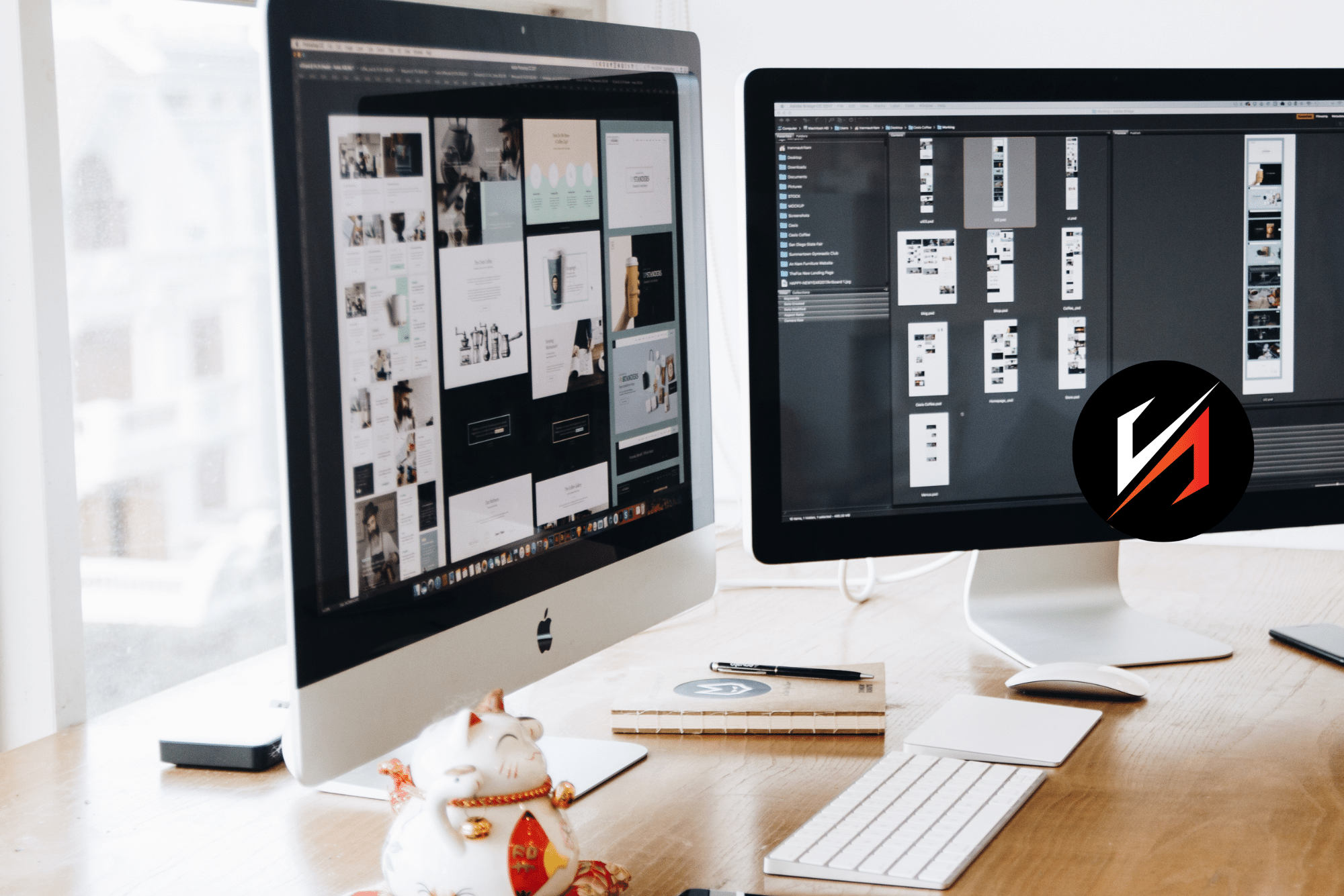 Dual iMac monitors displaying website design layouts