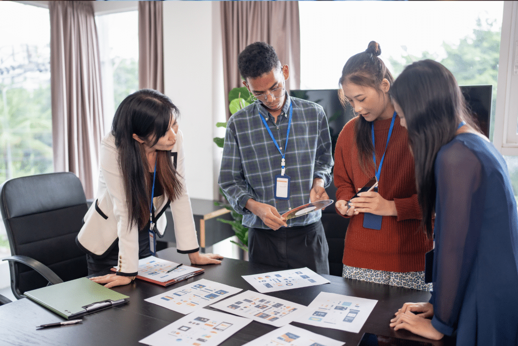 Team reviewing design mockups in office meeting